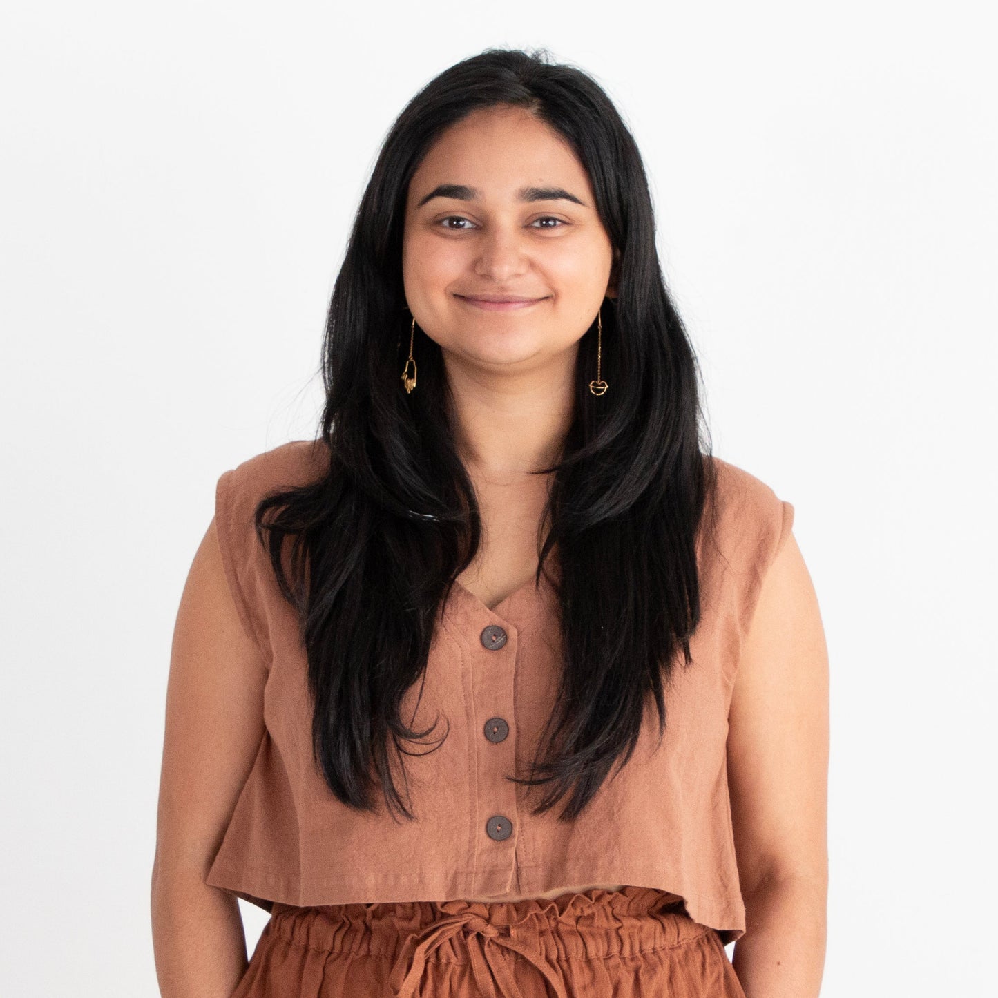 Woman wearing a brown outfit on a white background