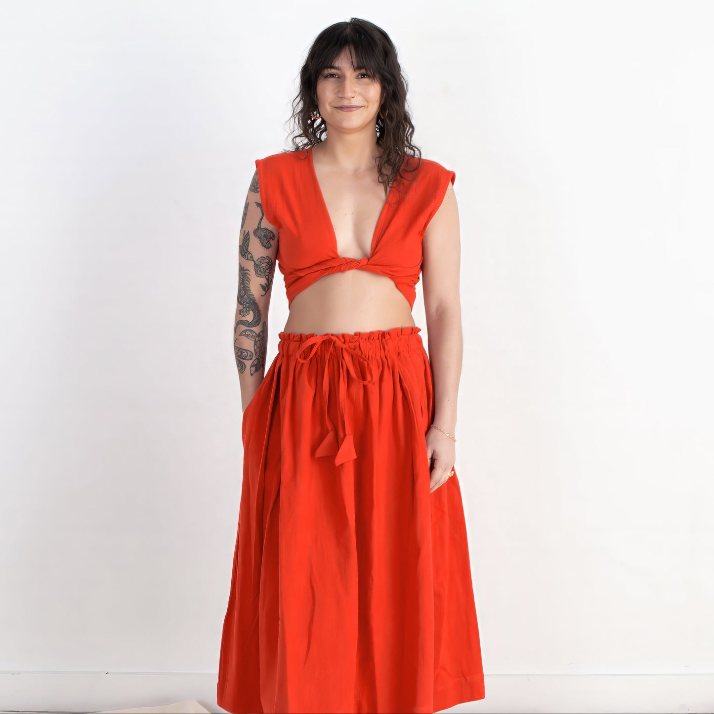 Woman wearing a red outfit on a white background